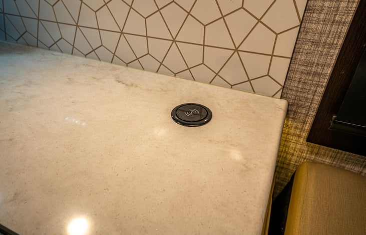 Wireless charging pad on top of power tower.