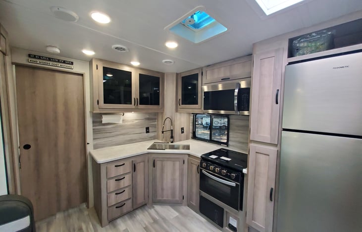 Spacious kitchen w/window. Sliding door to bedroom. Skylight/vent in kitchen.