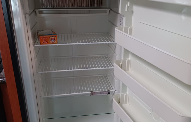 Large refrigerator can be powered by AC or LPG.