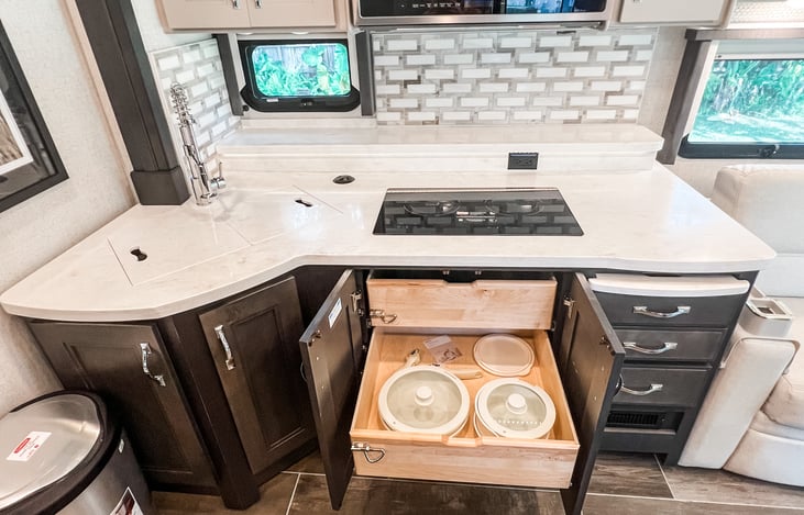 Organized storage solutions with pull-out drawers for all your cooking essentials