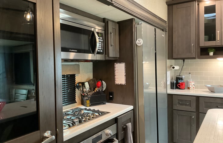 High ceilings and cabinets give an open airy feel to the living space.