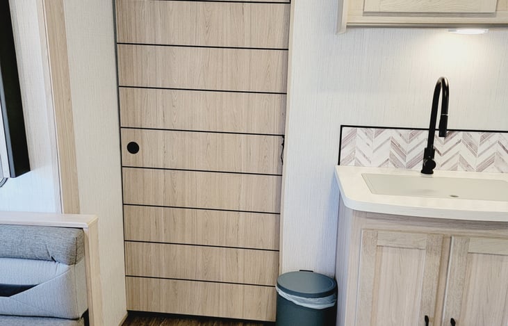 Privacy door, spacious kitchen, modern sink and lots of storage space.