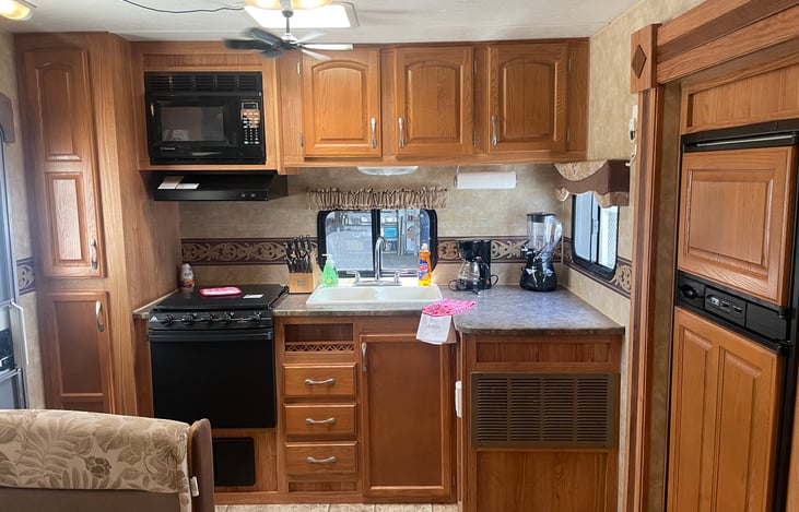 Kitchen - fully equipped with dishes, cookware, bakeware, grilling utensils, coffee maker, blender, dish & hand soap, dish towels & rags and fire extinguisher.