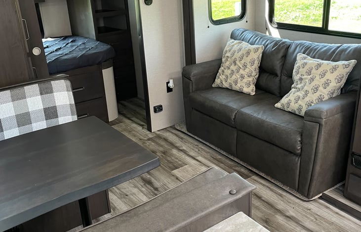 Spacious living area. Seating for 6.

Couch folds into a full-sized bed. (sleeps 2)
Table folds into a twin bed. (sleeps 1)