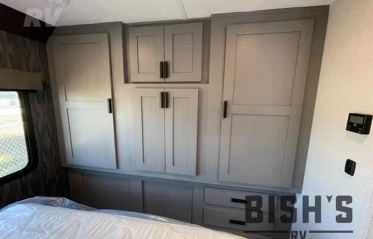 full wardrobe closets in bedroom.