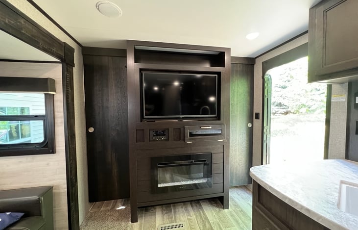 Slider doors for the queen bedroom. TV swivels for bedroom viewing and the other side is a mirror.