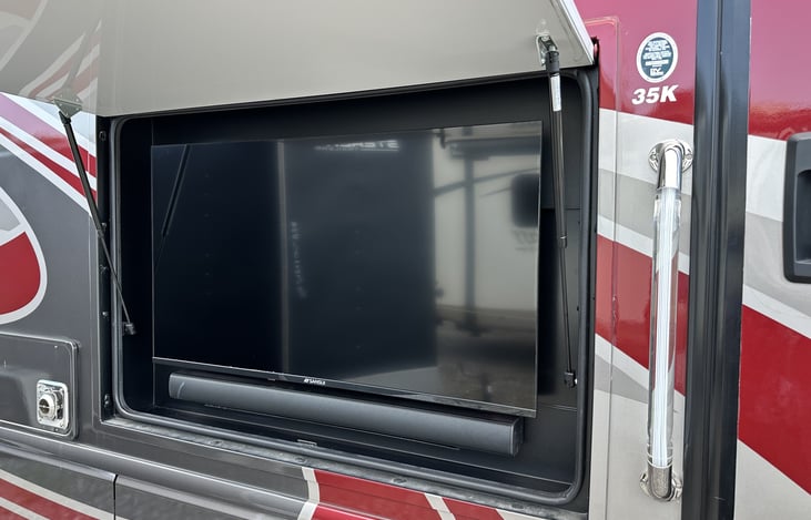 4 Televisions (2 with soundbars) including this outside TV to gather under the awning