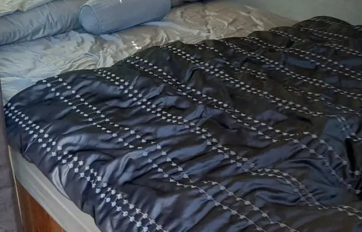 Queen sized bed in front.