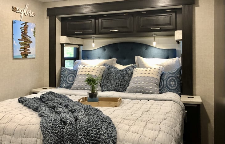 KING-SIZE bed with padded headboard, upgraded mattress and high-thread-count linens.