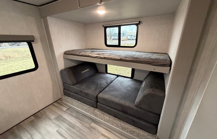 Upper Bunk in down position. Lower beds can fold out for two more sleeping spaces.