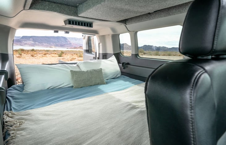 The bottom dinette/desk area transforms into a bed.