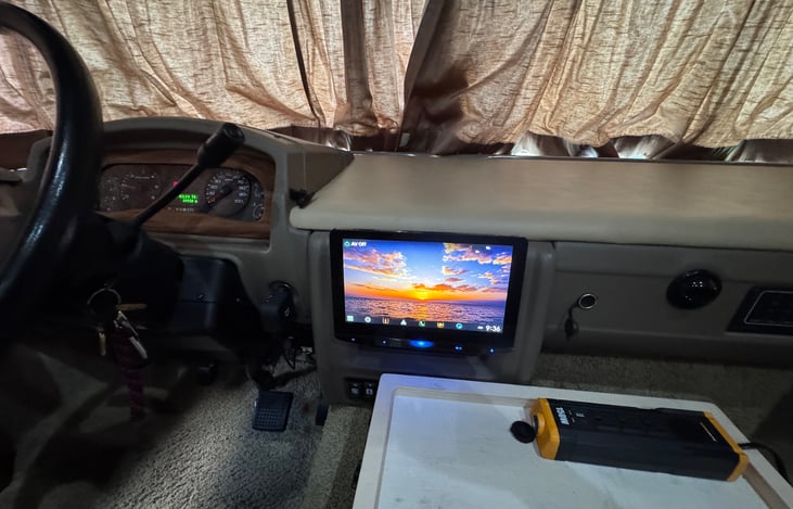 The radio features Apple CarPlay and Android Auto. There are USB and USB-C connections to charge phones.