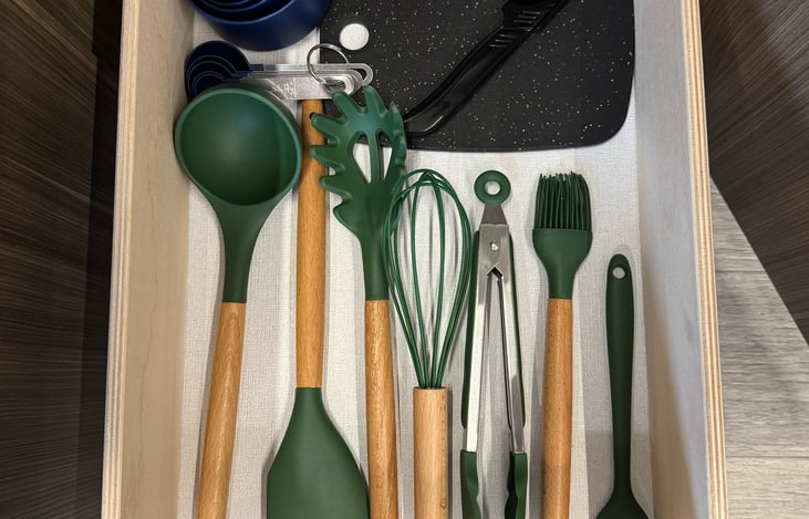 Kitchen utensils, measuring cups, measuring spoons and small cutting board/knife provided.