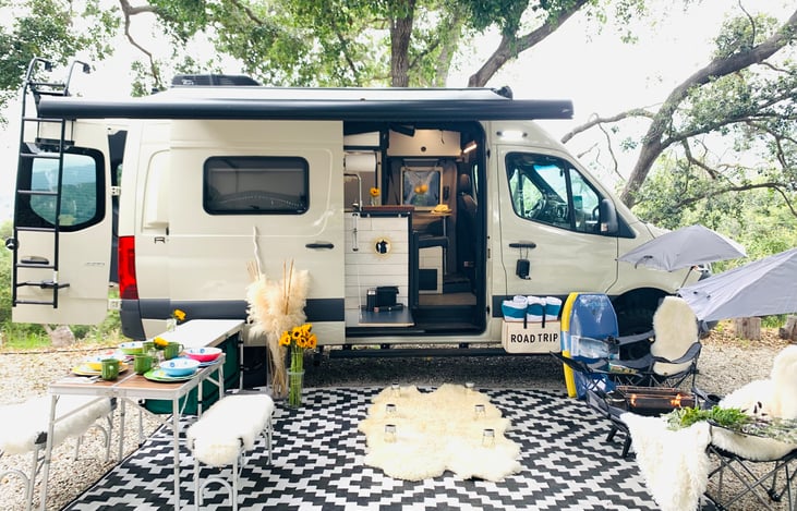 Here you will see what is included with your rental.  Dining table for 4.  Plates and silverware for 4, side table for prepping in your camp, outdoor living room rug, two lounging chairs w umbrellas.