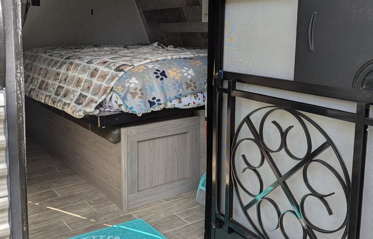 Kool-Aid Dog Proof screen door cover and the main bed with a very comfy mattress.