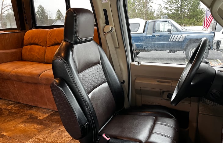 Nice and comfortable captains chairs that turn around for extra seating when parked.