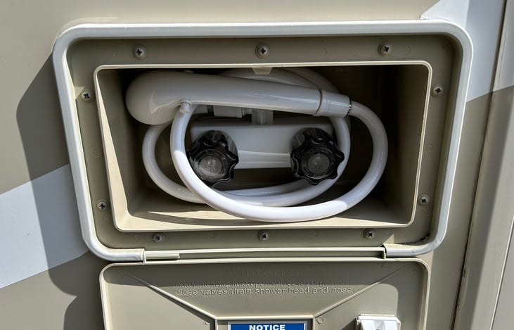 Outdoor hot and cold shower for cleaning off the dirt or sand. The water is on-demand heated water.