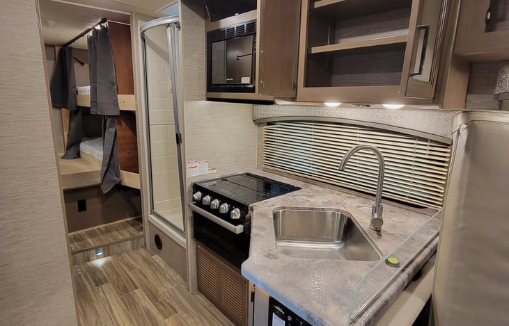 Kitchen leading into rear bedroom