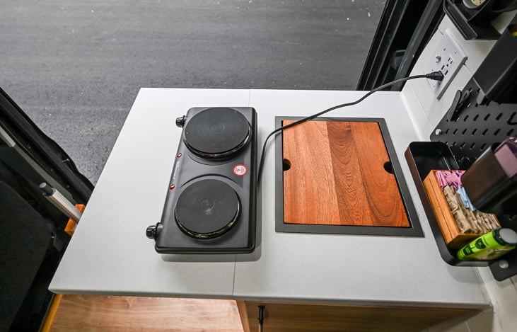 Portable 2-burner electric stove for easy indoor cooking.