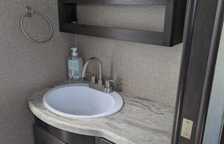 Spacious bathroom with large shower.