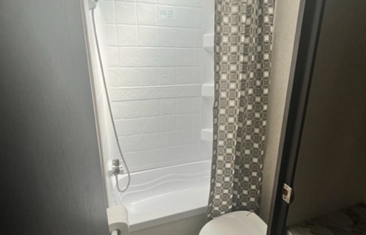 Shower and toilet with skylight and fan