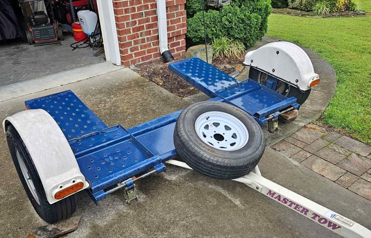 We have a master tow dolly available for rent, $20 per day!