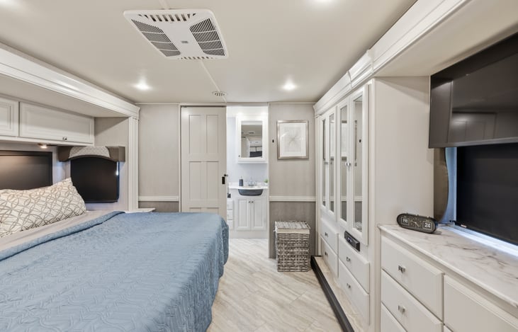 King size bed with new custom mattress.  You'll want to sleep in every chance you get!