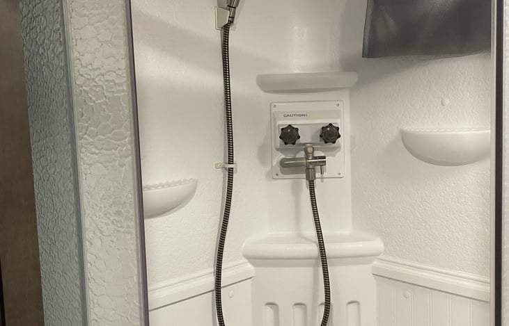 Shower with tankless water heater