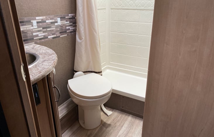 Toilet, shower and sink in the bathroom area.  Please only use RV toilet paper.