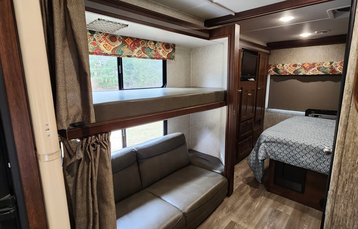 Bottom couch folds down for extra sleeping room and can sleep 2 kids if necessary