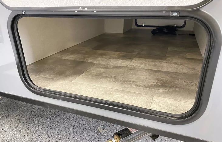 Rental includes cables and hoses necessary for full hookup.  Three gravity chairs, campfire sticks and camp mat are also provided.  There is still ample storage for items you would like to bring.