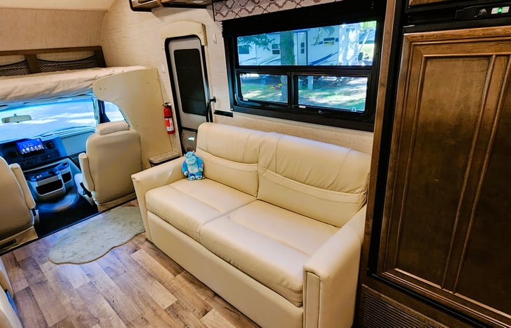 SUPER comfy jack knife couch that can easily fold out into a bed.   Sully usually calls dibs.