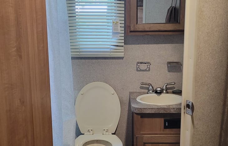 Bathroom, shower with small tub.