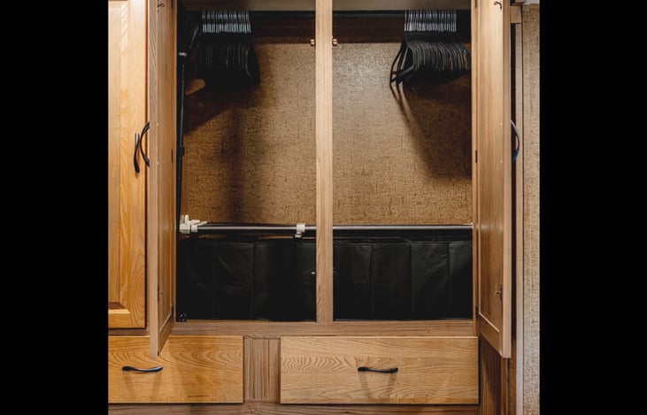 Spacious wardrobe with hangers (50) and extra storage baskets and drawers.