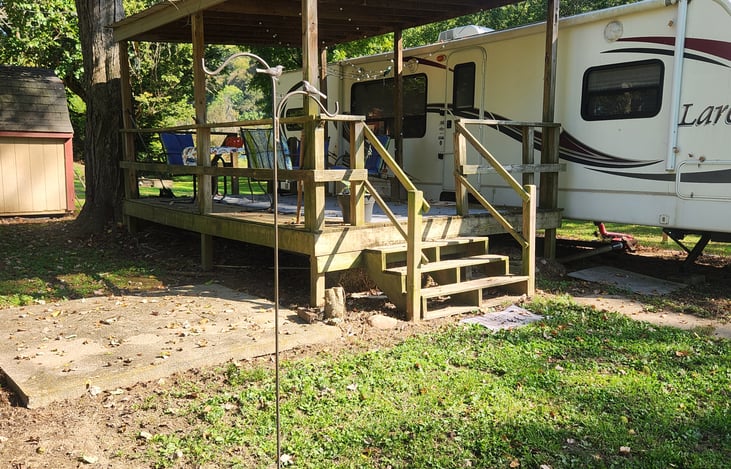 Cement pad perfect for firepit or grill.