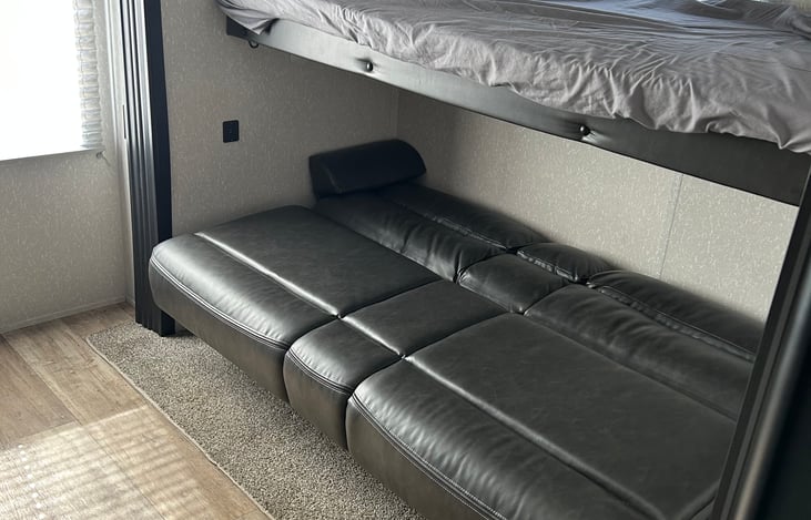 Bunk room couch opened up to a bed