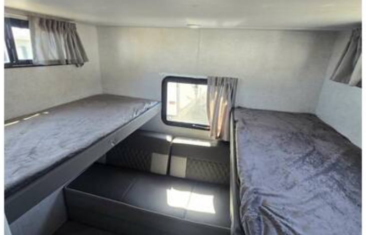 Double bed bunk room with queen sofa fold out mattress. Both bunk beds fold up for roomy walking area and has Roku TV. Sleeps 4-5 comfortably. Bunk room is opposite side from master bedroom.