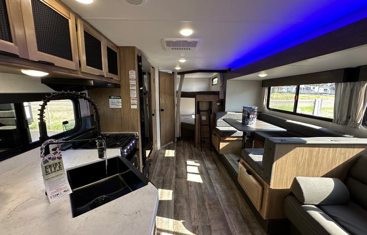 Spacious interior layout with open living, kitchen, and bunkhouse