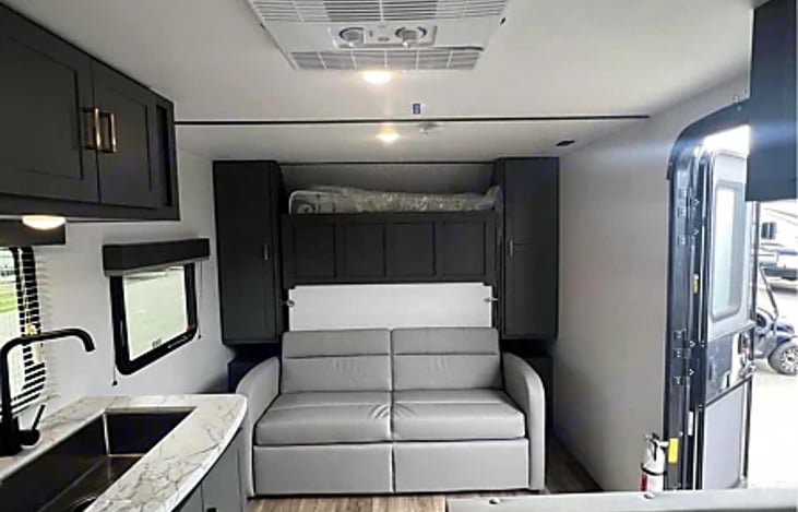 The couch that cleverly hides a queen-size Murphy bed. By day, it's a comfortable seating area for relaxation and socializing. When night falls transform it into a spacious bed.