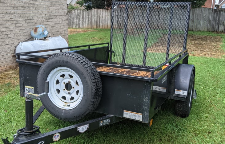 Available 8-foot trailer with a steel ramp for toys, kayaks, grills, or whatever you think of.
