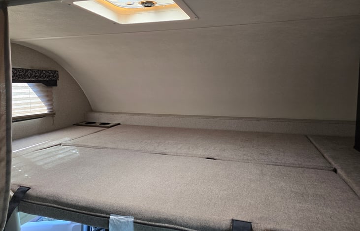 Bunk above cab, equipped with Queen Bed