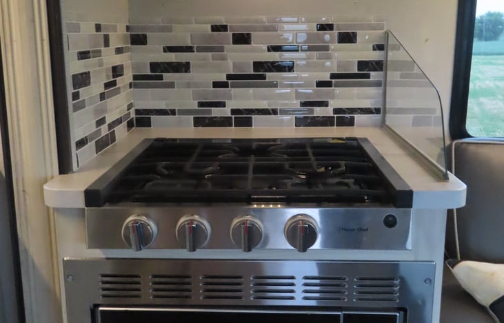 Propane stove top. When using for storage, we have included a wooden tray to set on top to hold all those small articles.