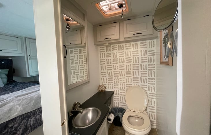 The bathroom door serves as the privacy door.