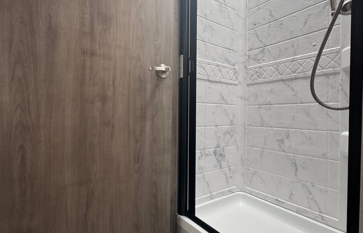 Roller shower door