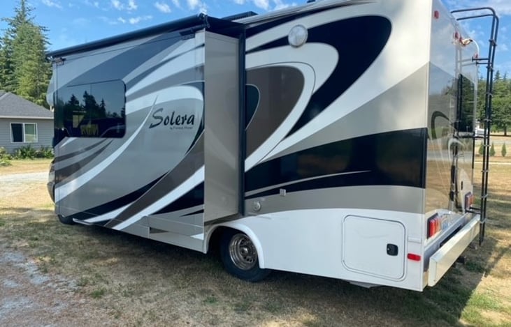 Storage compartment contains a hose, very convenient for washing feet, bikes, and other equipment.