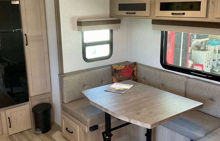 dinette converts into bed to sleep 2 more.