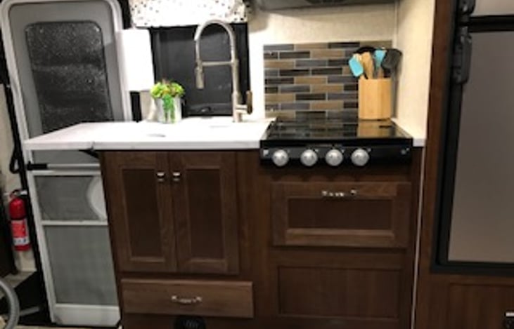 Extension on left swings up for additional counter space.