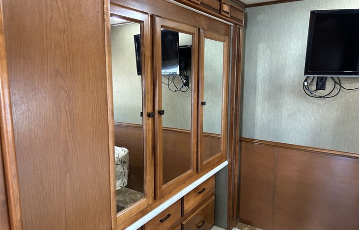 Large master bedroom closet and drawers.