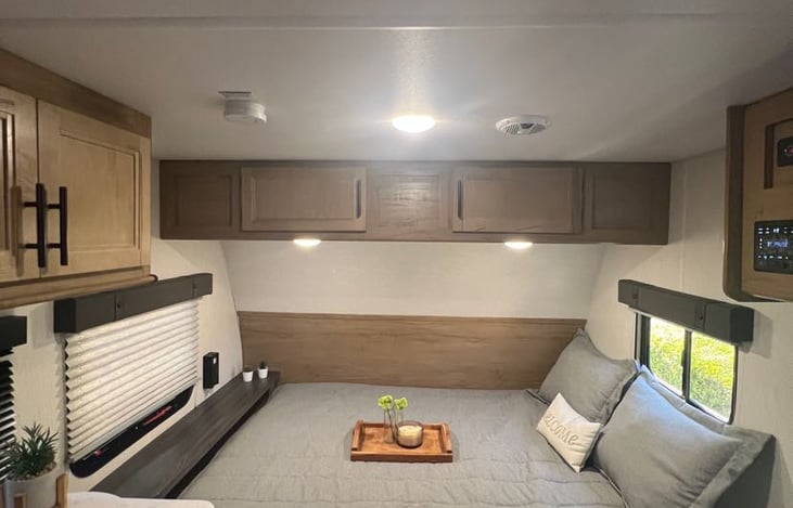 Queen bed with storage underneath.