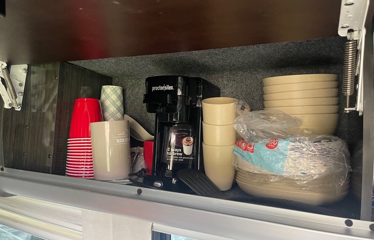 Overhead Storage area: currently with dishware and kcup machine